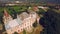 Vertical aerial view of beautiful medieval castle on sunny summer day