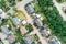 Vertical aerial view of a suburban settlement in Germany with detached houses, close neighbourhood and gardens in front of the hou