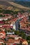 Vertical aerial view of the town center of Rupea, Romania, with hills and agricultural fields