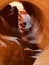 Vertical amazing shot of an inside  view of  Antelope Canyon with a hole and rocky texture