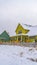 Vertical Appealing homes amid an icy landscape on a cloudy winter day in Daybreak