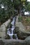 Vertical artificial waterfall with stones. Parque de Maria Luisa, Sevilla, Spain