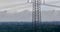 Vertical ascent along a power pole with the cloudy skyline of Frankfurt in the background after a thunderstorm