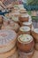 Vertical of an assortment of local Italian cheeses stacked on a table in a city market