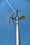 Vertical axis wind turbine under blue sky