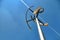 Vertical axis wind turbine under blue sky