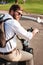 Vertical back view image of Cool bearded man in sunglasses