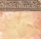 Vertical background with ancient Egyptian hieroglyphs on stone wall, Egypt, Africa. Backdrop with sandstone carving with
