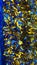 Vertical background of blue and gold shiny Classic Tinsel Garland. Traditional Christmas decoration. Xmas collection magic festive