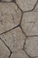 Vertical background made of gray polyhedral stone solid base