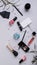 Vertical banner. Cosmetics and fashion blogger background. Flat lay. Makeup, accessories on a light background. Top view shot