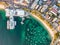 Vertical bird`s eye aerial evening drone view of Manly wharf, part of the oceanside suburb of Manly, Sydney, New South Wales