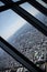 Vertical birds-eye view of a city from the skyscraper glass window