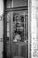 A vertical black and white close up shot of a restaurant window