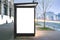 Vertical blank glowing billboard on the bus stop.