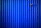 Vertical blue fence with empty socket for electric lamp background