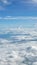 Vertical blue sky cloudscape background from aerial view