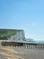 Vertical breathtaking view of Seven Sisters cliff at a distance in East Sussex, England