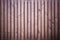 vertical brown wooden slats background with dark vignette corners for creative designs