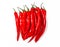 Vertical bunch of oblong red chili peppers. White background isolated. Vitamins, healthy food