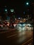 Vertical of the busy streets of Okinawa, Japan illuminated at night