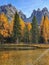 VERTICAL: Calm Lake Antorno on a sunny autumn day in picturesque South Tyrol.