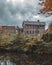 Vertical of Canal side Birmingham captured in autumn foliage captured under a cloudy sky