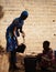 Vertical Candid Photo of Malian African Girls Collecting Water