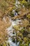 Vertical Cascading Mountain Waterfalls in a Boulder Field