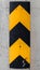 Vertical caution striped yellow and black sign