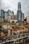 Vertical cityscape of the skyline of Chongqing at dusk with illuminated buildings including the Hongya cave in Chongqing China