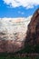 Vertical cliffs of rock formations in Zion Canyon