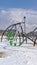 Vertical Climbing frames on a playground blanketed with snow on a sunny winter day