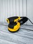 Vertical close up circular power sander,new black yellow surface sanding machine,gray white wooden boards .Copy space