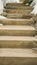 Vertical Close up of concrete outdoor steps on a slope covered with fresh snow in winter