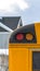 Vertical Close up of the rear of a school bus with a window and several signal lights