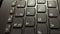 Vertical close up shot of black laptop keyboard