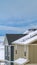 Vertical Close up view of the exterior of snowy homes during winter season
