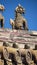 Vertical closeup of beast statues on the roof of the Imperial Palace in Pekin, China