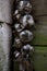 Vertical closeup focus shot of hanging garlic string