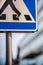 Vertical closeup of the fragment of a zebra pedestrian street sign.