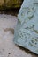 Vertical closeup of a mossy Armenian cross-stone, khachkar