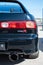 Vertical closeup of a rear of a black third-generation Honda Integra Type-R