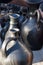 Vertical closeup shot of beautiful  earthenware black jars