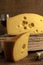 Vertical closeup shot of a block of gourmet swiss cheese