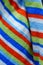 Vertical closeup shot of a colorful striped hand towel