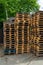 Vertical closeup shot of empty wooden pallets stacked on top of each other outdoors