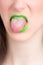 Vertical closeup shot of a female wearing a green lipstick - great for an article about cosmetics