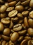 Vertical closeup shot of fresh brown coffee beans roasting