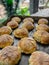 Vertical closeup shot of freshly baked round cookies on a tray